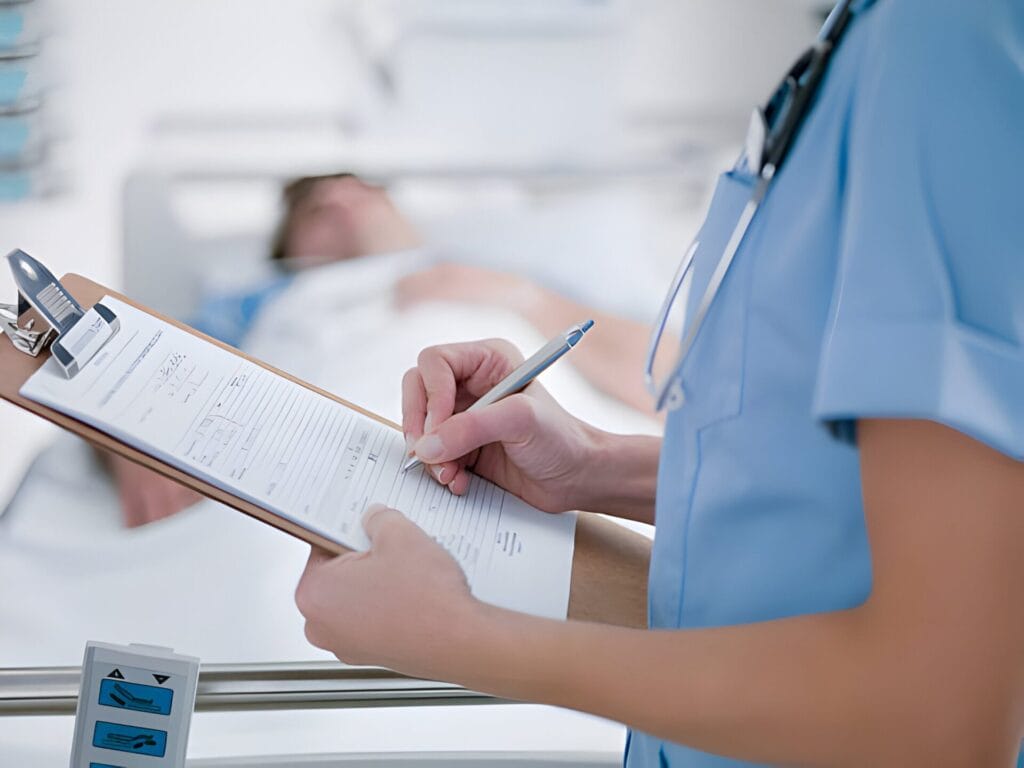 doctor writing on clipboard