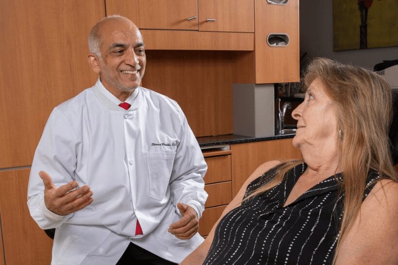 Dr Sharad Pandi consulting female patient about child sleep apnea diagnosis