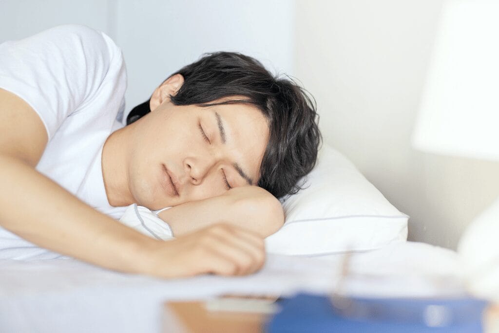 Man sleeping with troubled expression showing possible teeth grinding