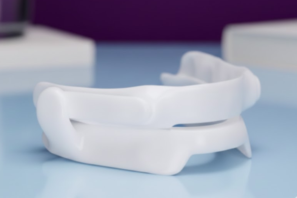 Close-up view of a mandibular advancement device for sleep apnea.
